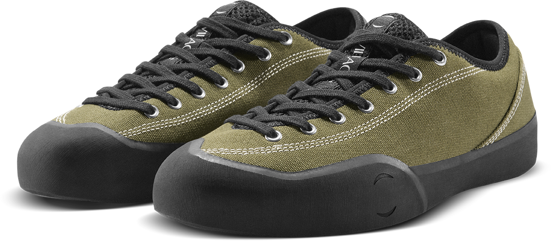 A pair of low-top sneakers with olive green canvas uppers, black laces, black rubber toe caps, and black soles, shown on a clean white background.