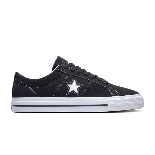 side view of black/white low top suede skate shoe with one star logo