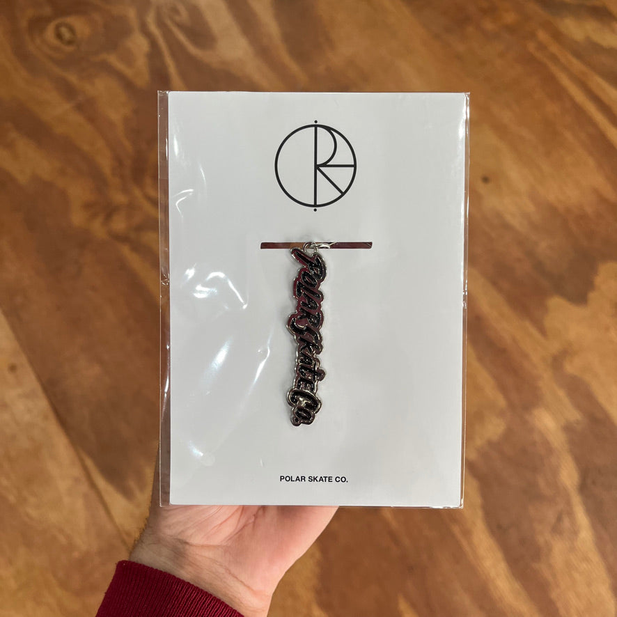 Keychain the says "Polar skate co." in black