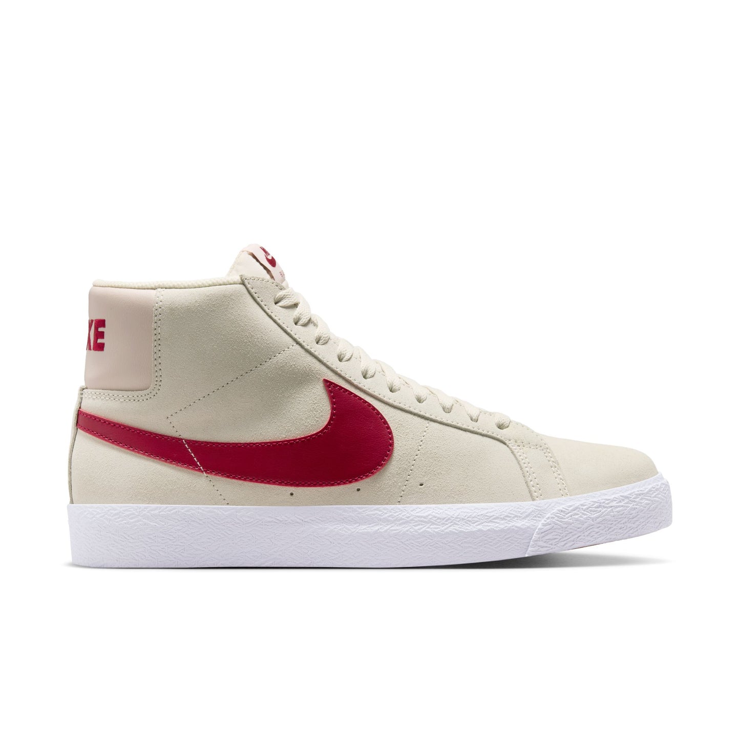Beige sneaker with red swoosh logo on a white background