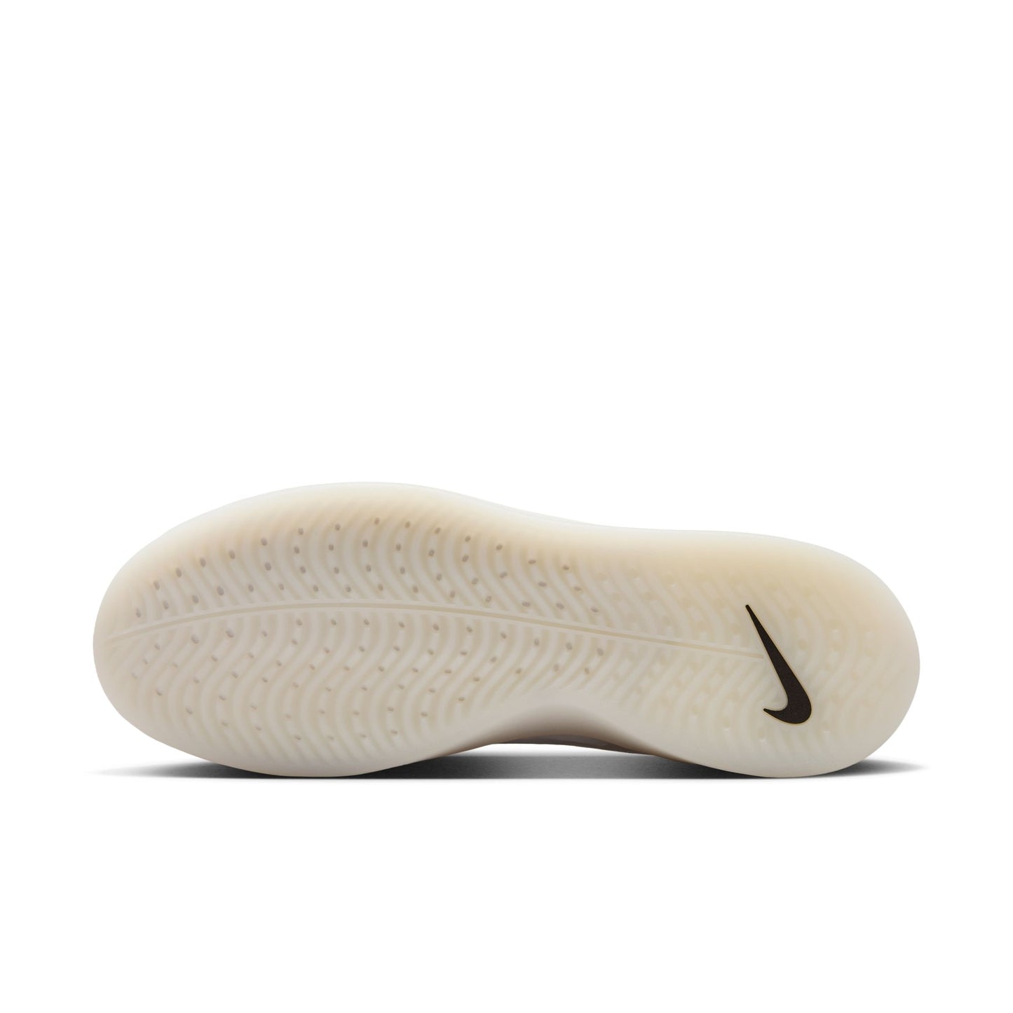 Close-up of a Nike shoe sole with tread pattern and logo on a white background
