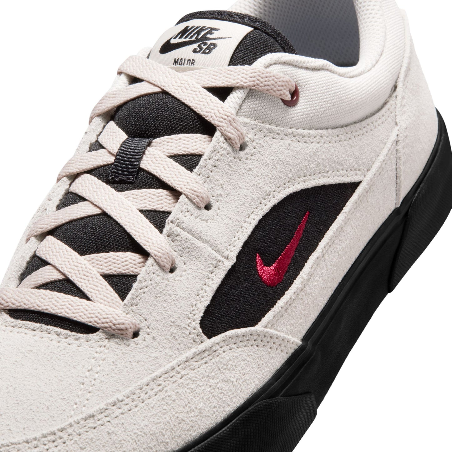 close up of White sneaker with black and red accents featuring Nike SB logo on a white background