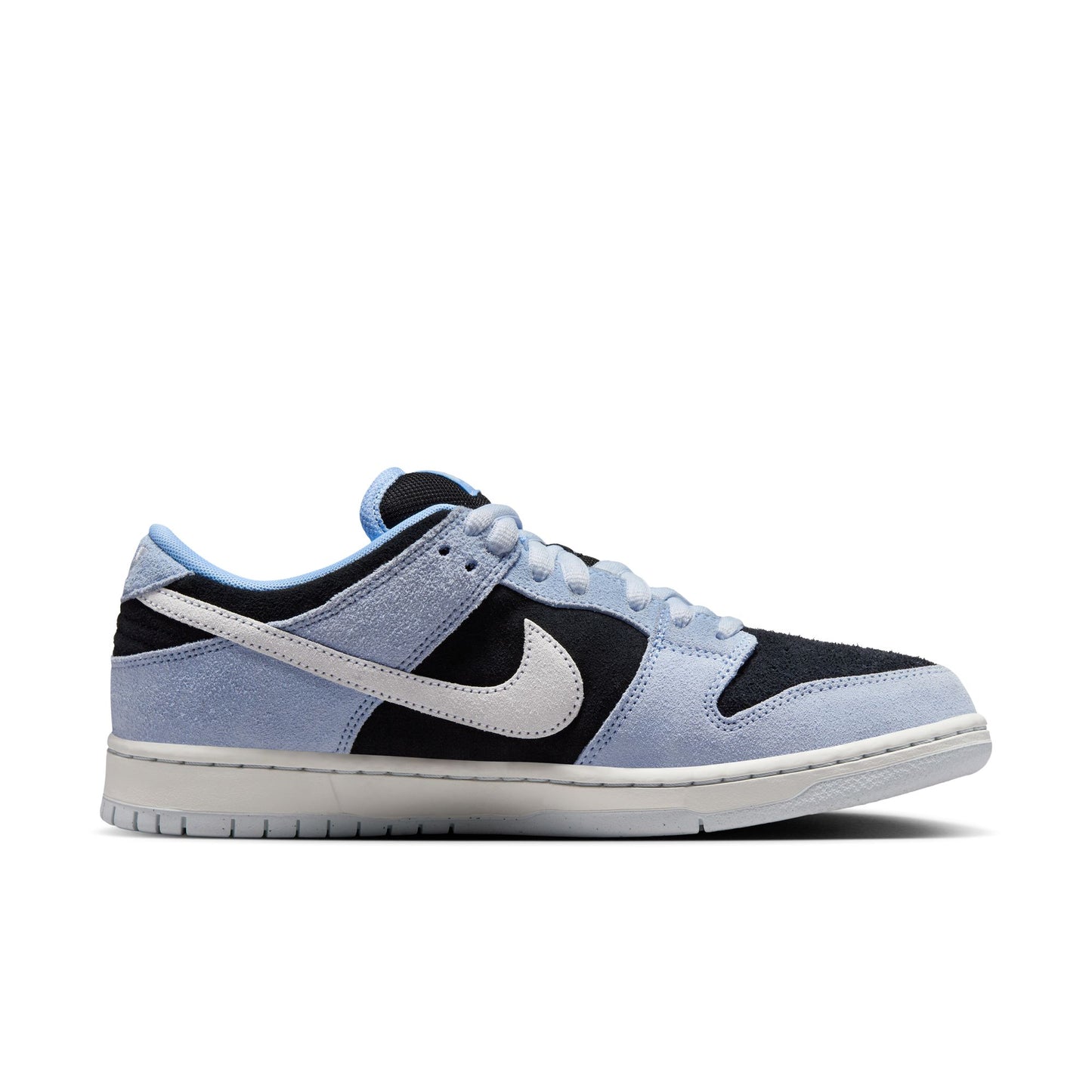 side view of light blue, white, and black suede low top Nike sb sneaker