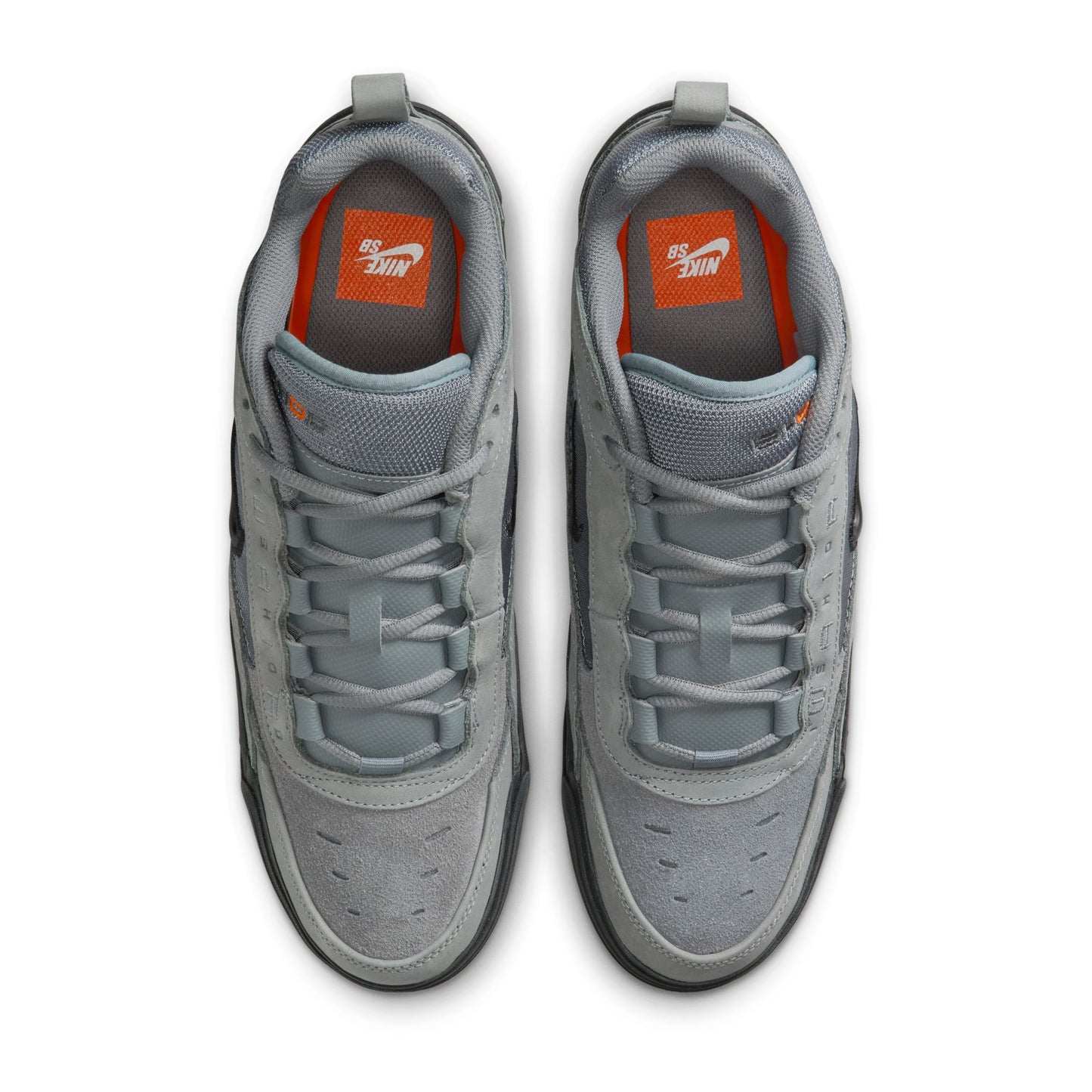 Gray sneakers with orange accents on a white background
