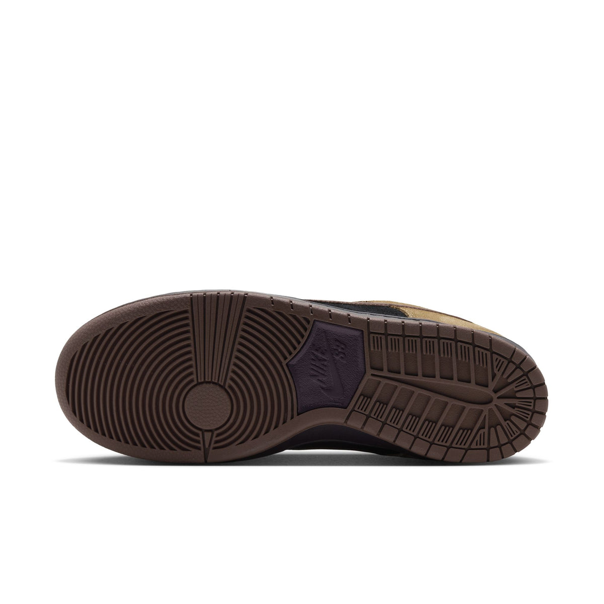 The outsole of a Nike sneaker, showing a dark brown textured rubber tread with a dark purple Nike Swoosh logo on the heel, photographed against a solid white background.