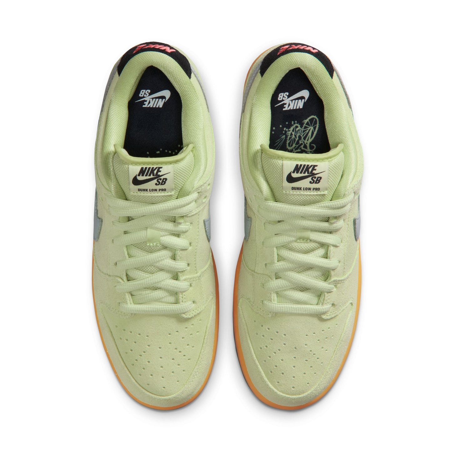 Pair of light green Nike SB sneakers on a white background