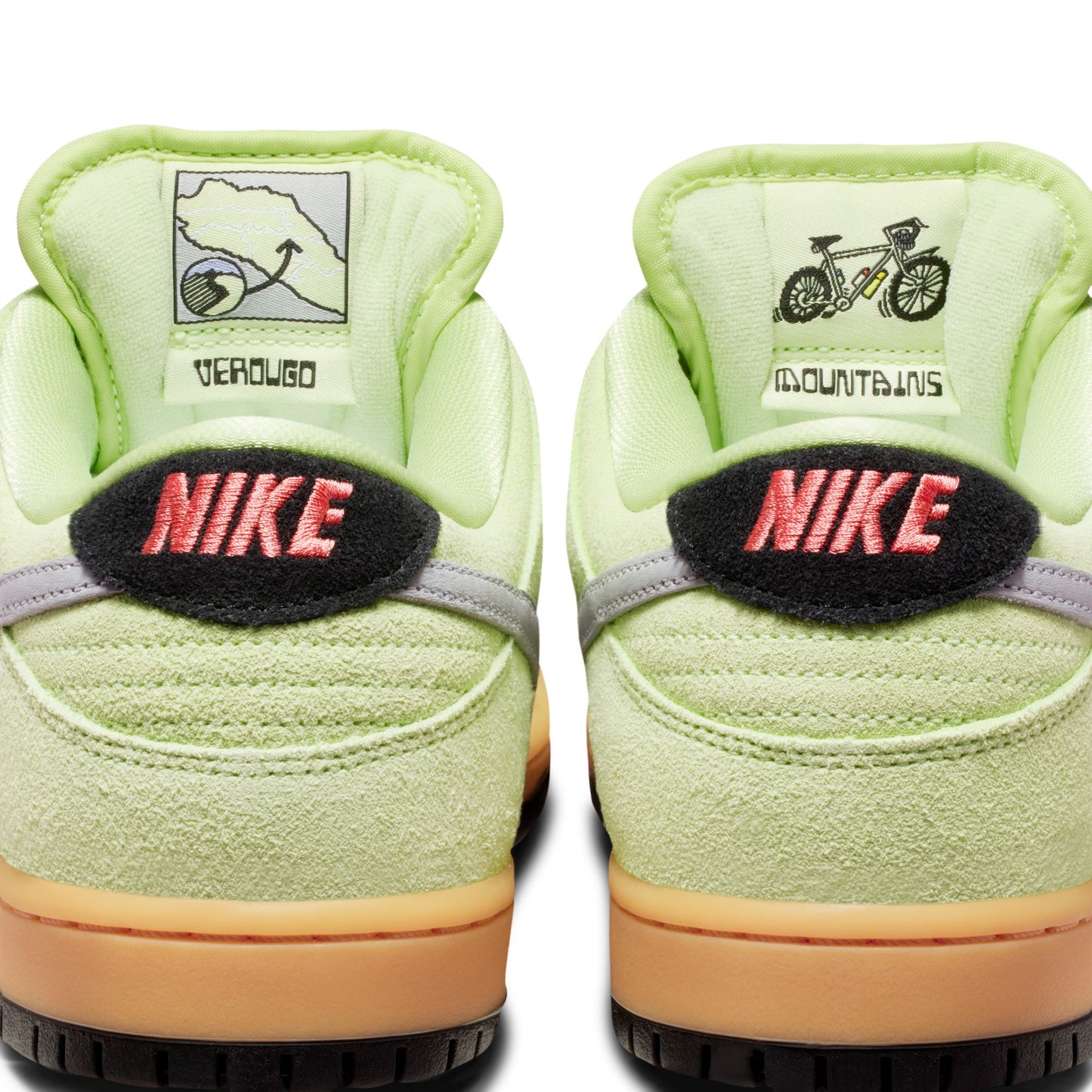 Light green Nike sneakers with brand logos on a white background