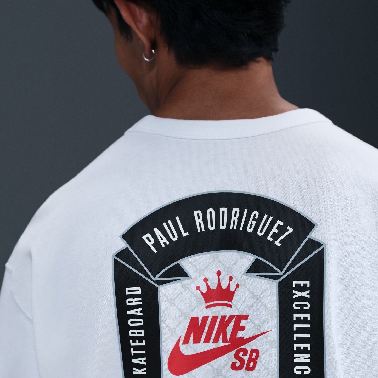 Person wearing a white t-shirt with 'Paul Rodriguez' and Nike SB logo on the back