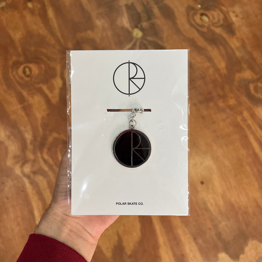 Keychain with a round black logo