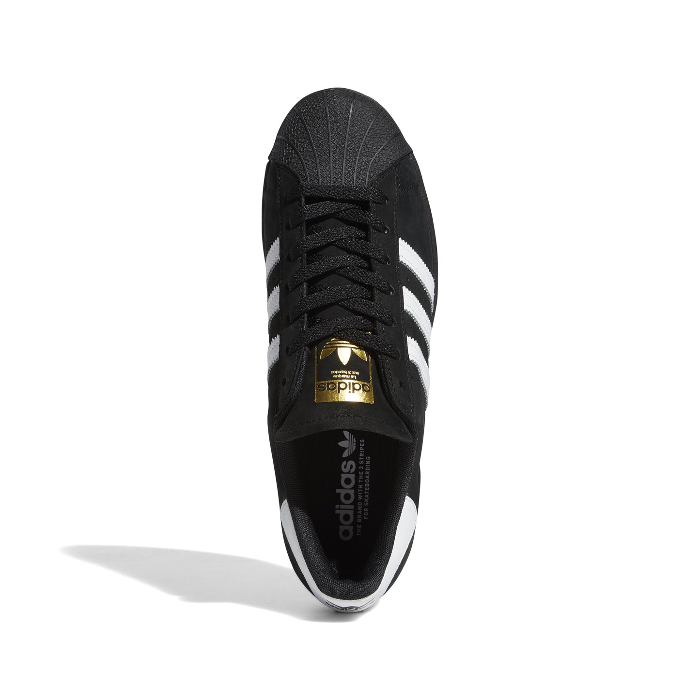 top down view of black nubuck adidas superstar shoe with white stripes