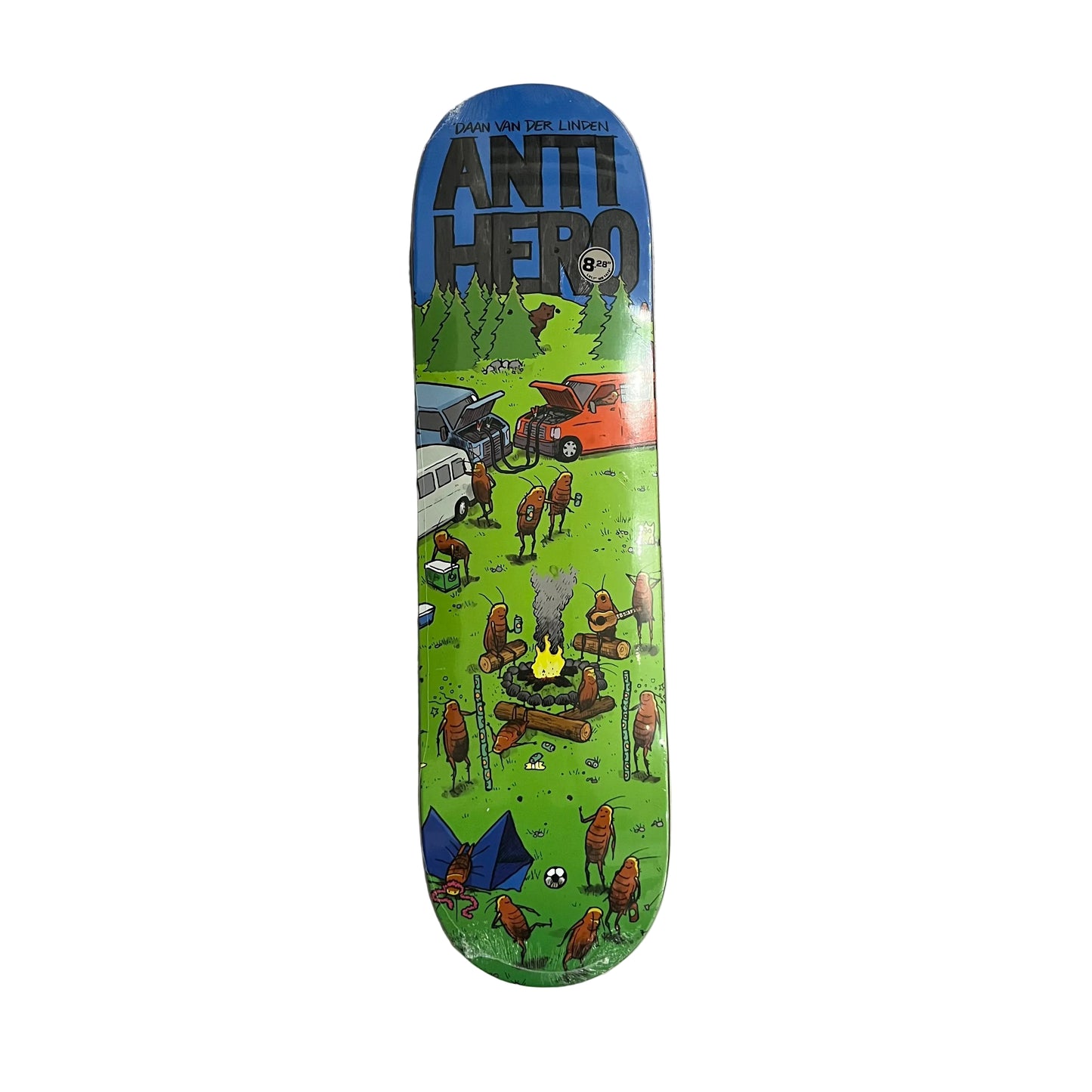 An Anti Hero skateboard deck featuring a colorful cartoon camping scene on a green background, with a blue top section and the brand logo at the top, photographed on a white surface.