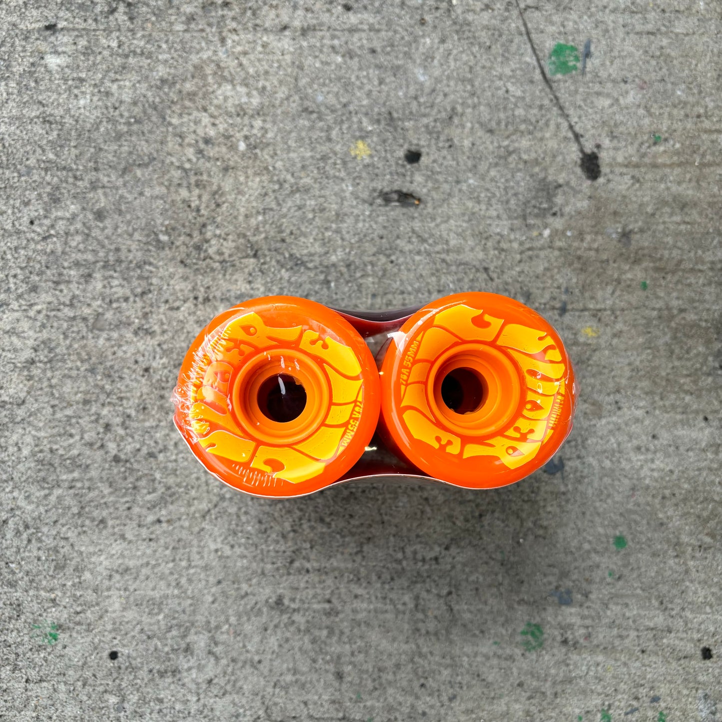 Top down view of mini cruiser wheel in orange