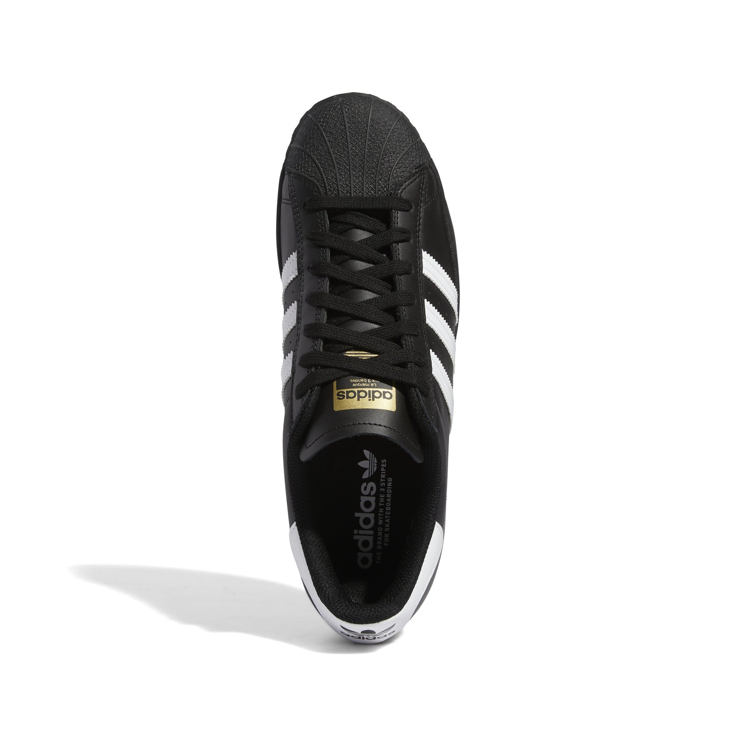 top down view of black leather adidas superstar with white stripes and heel tab
