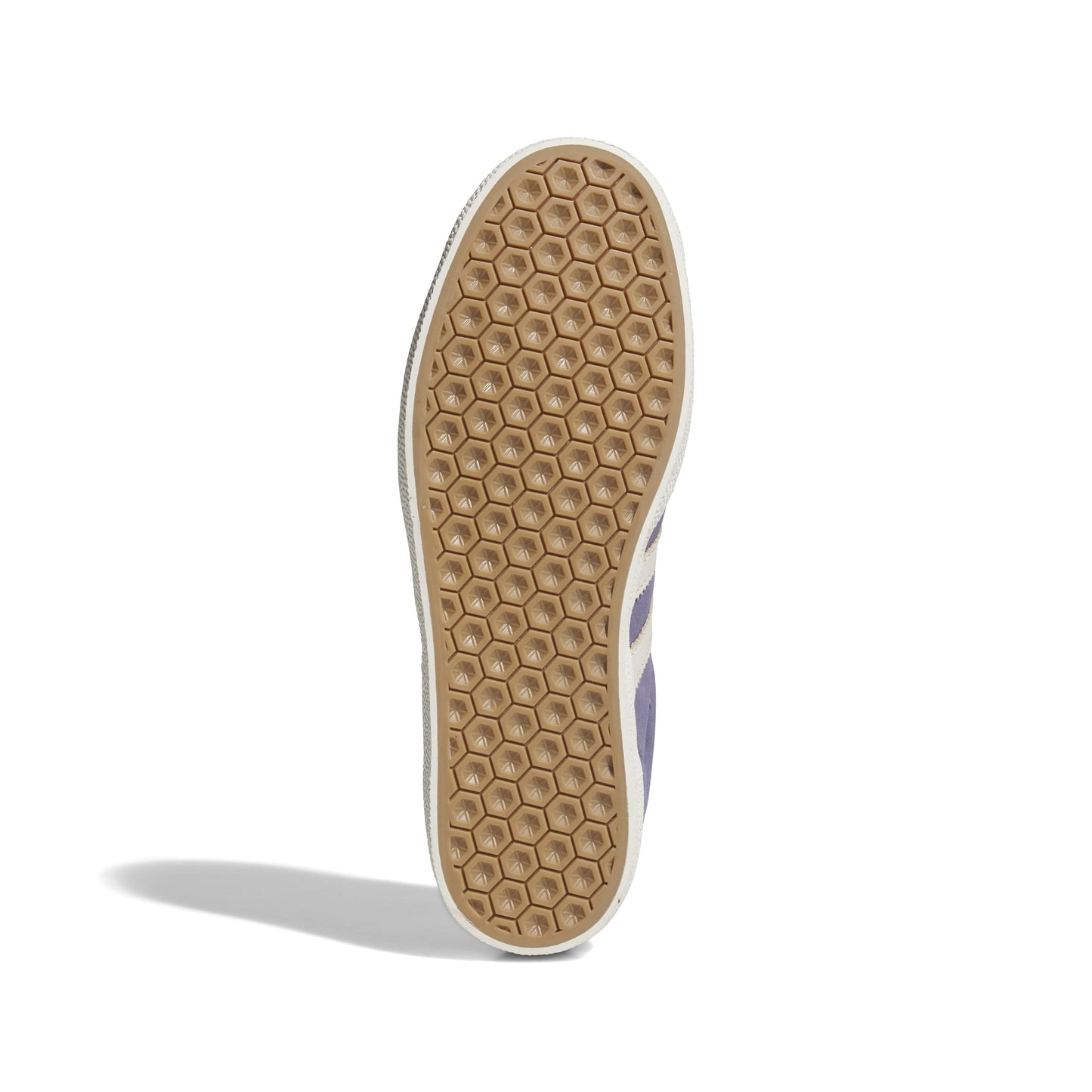 Close-up of a shoe sole with a honeycomb pattern on a white background