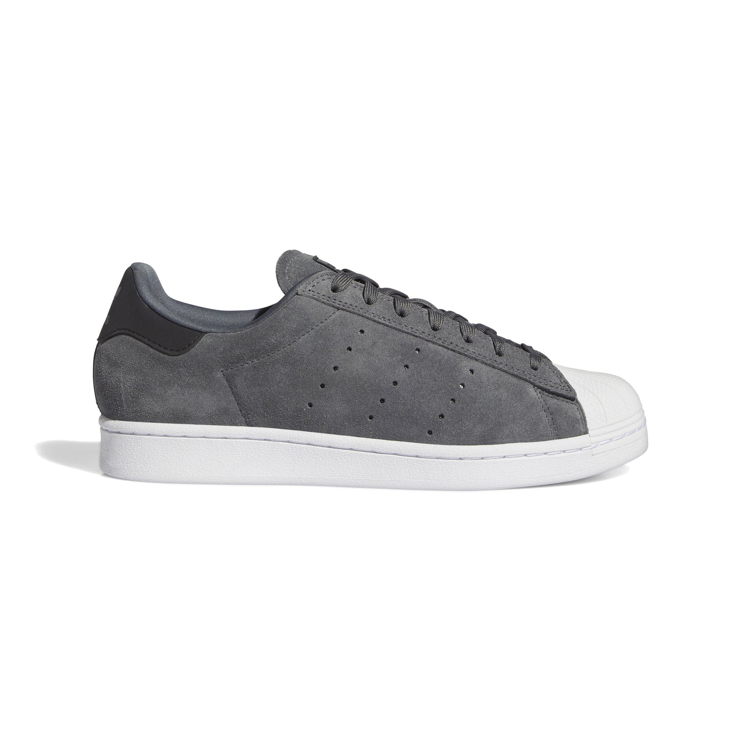 side view of grey and white superstar sneaker