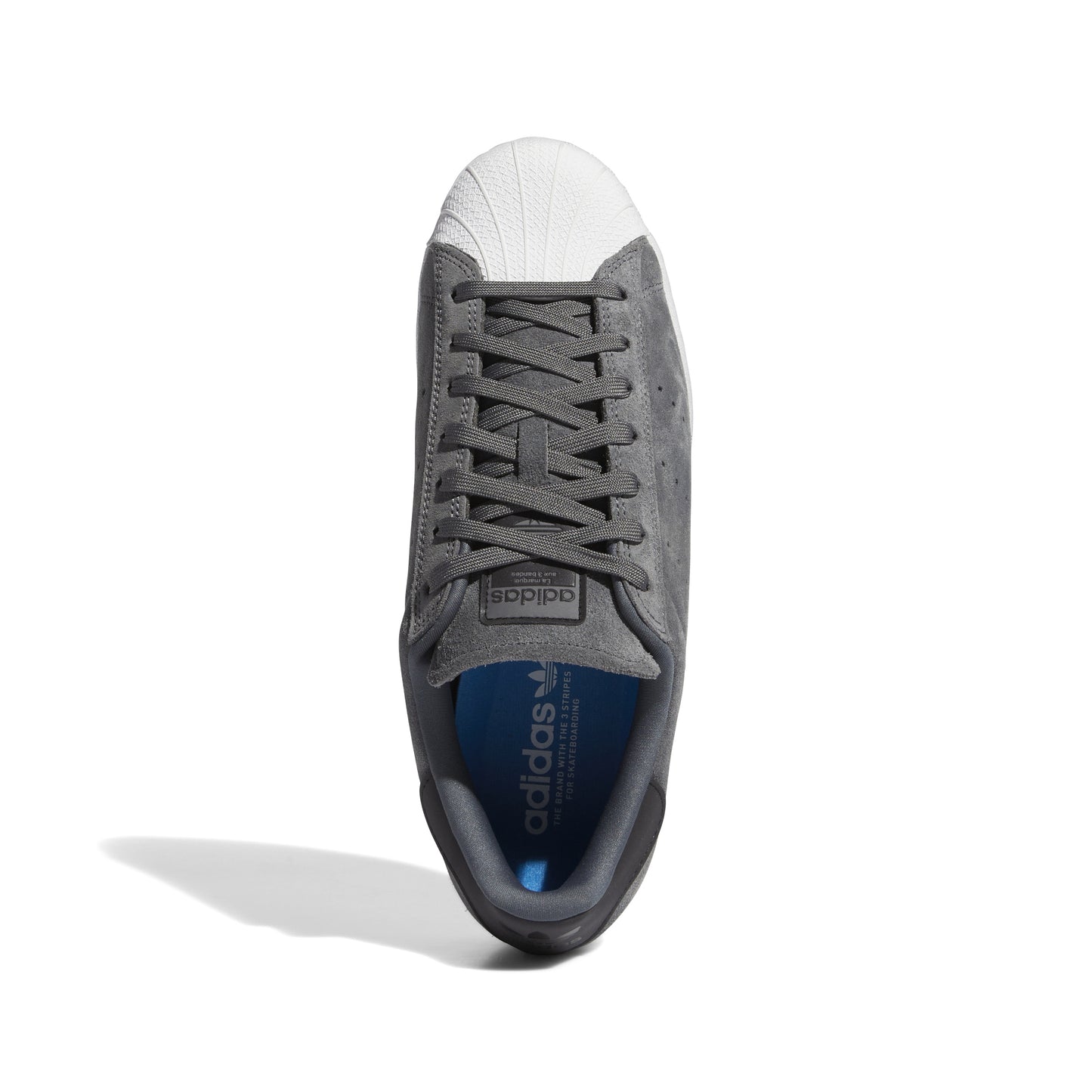 top down view of grey and white superstar sneaker