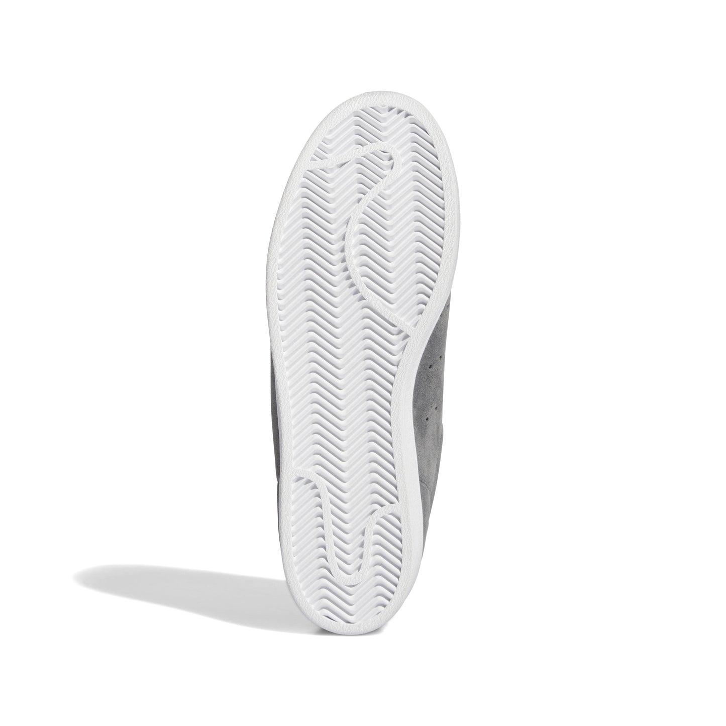 view of white outsole on superstar sneakers