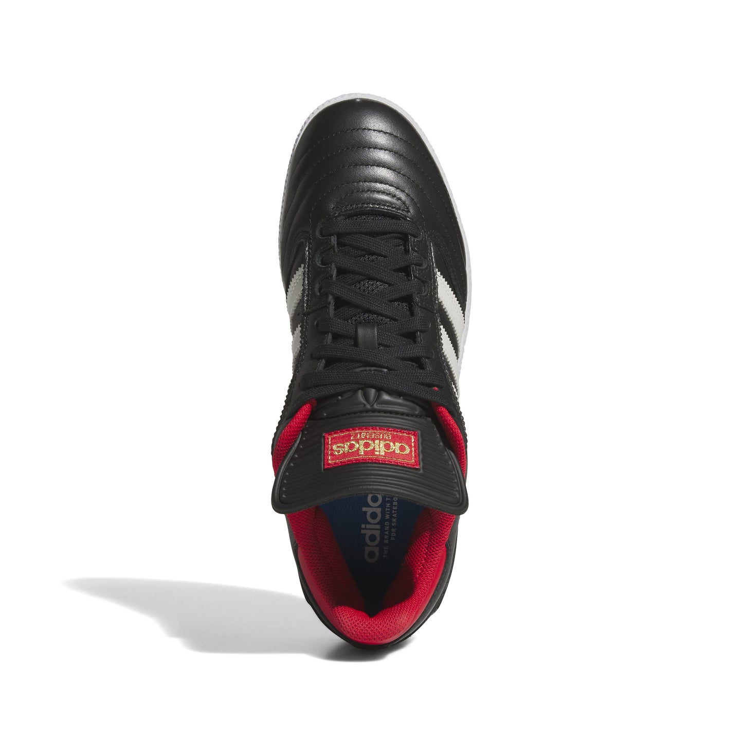 top down view of black leather soccer style shoe with red accented sockliner, three white stripes, and white sole