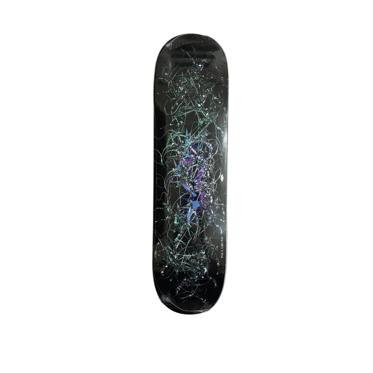 A skateboard deck with a black background and a complex graphic design featuring teal, green, and purple abstract web-like patterns, photographed from directly above on a white surface.