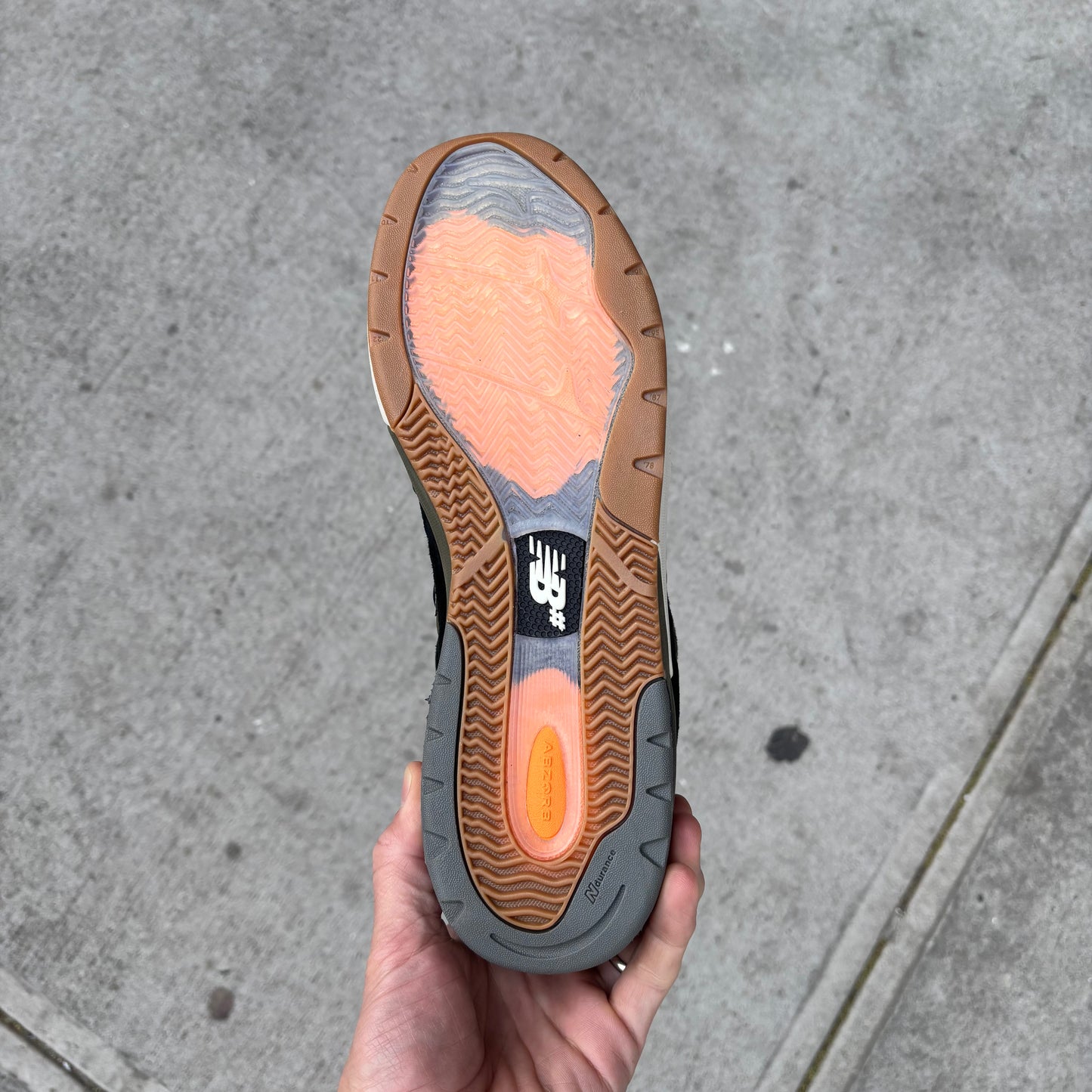 view of gum rubber outsole on new balance skate shoe