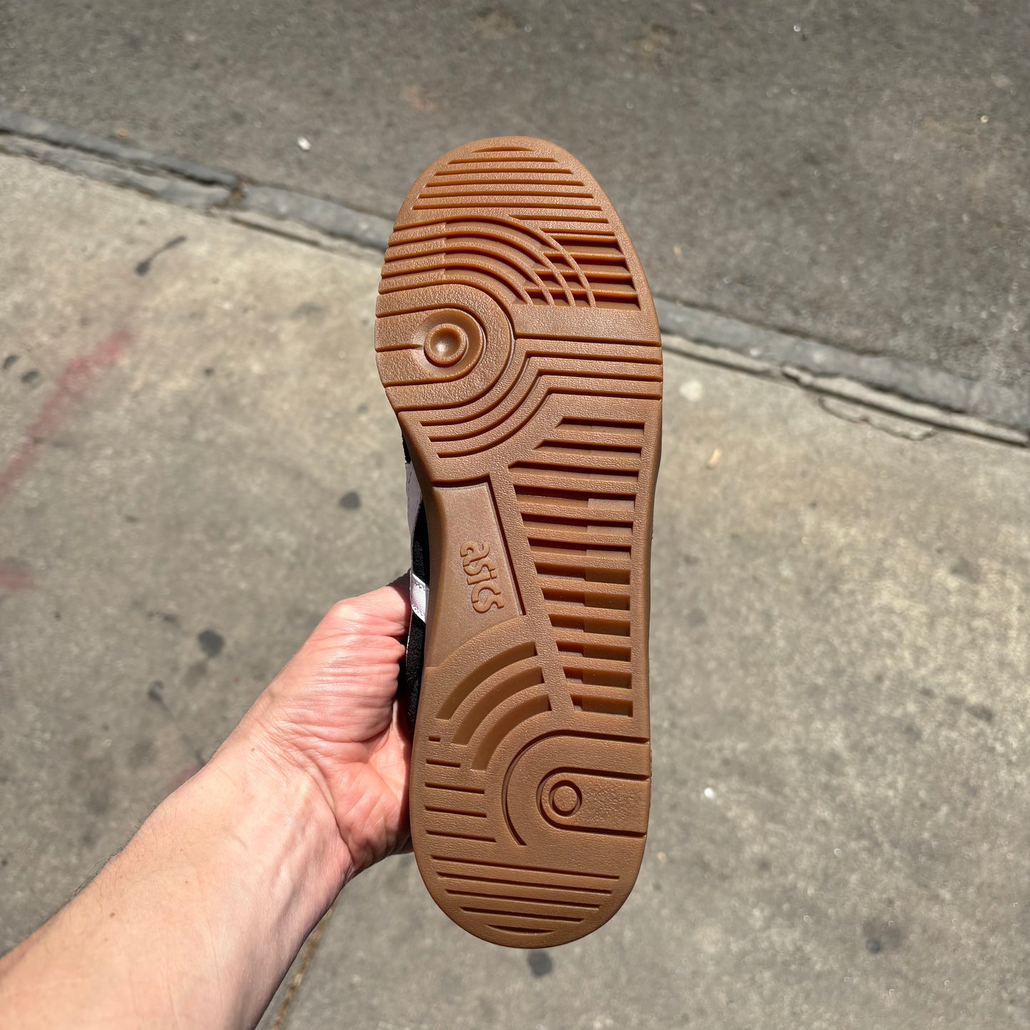 view of brown gum rubber outsole on skateboard sneaker