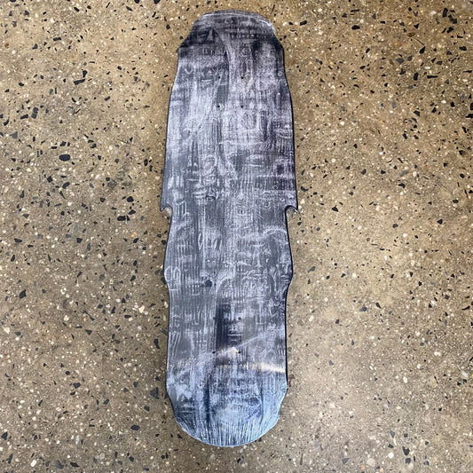 black dipped skateboard deck with abstract black white and greyish faces on it
