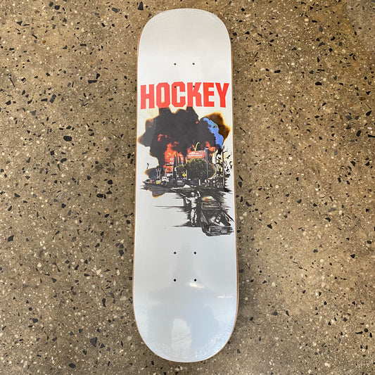 white skateboard deck with a cloud featuring an image of a burning building in the cloud with "hockey" in red text