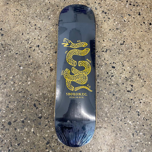 black skateboard with yellow snake graphic and text
