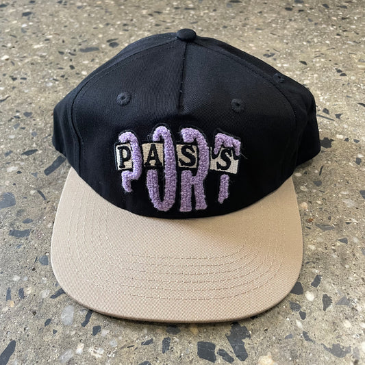 black and lavender hat with khaki bill
