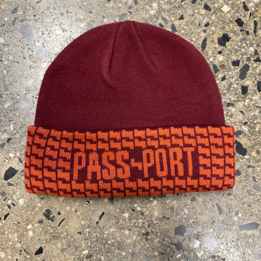 red and orange beanie with logo