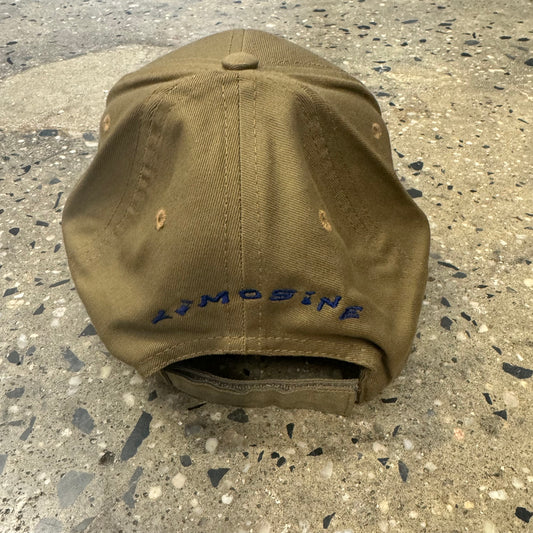 rear of tan hat with limosine typrface logo printed in an arch on back of six panel cap