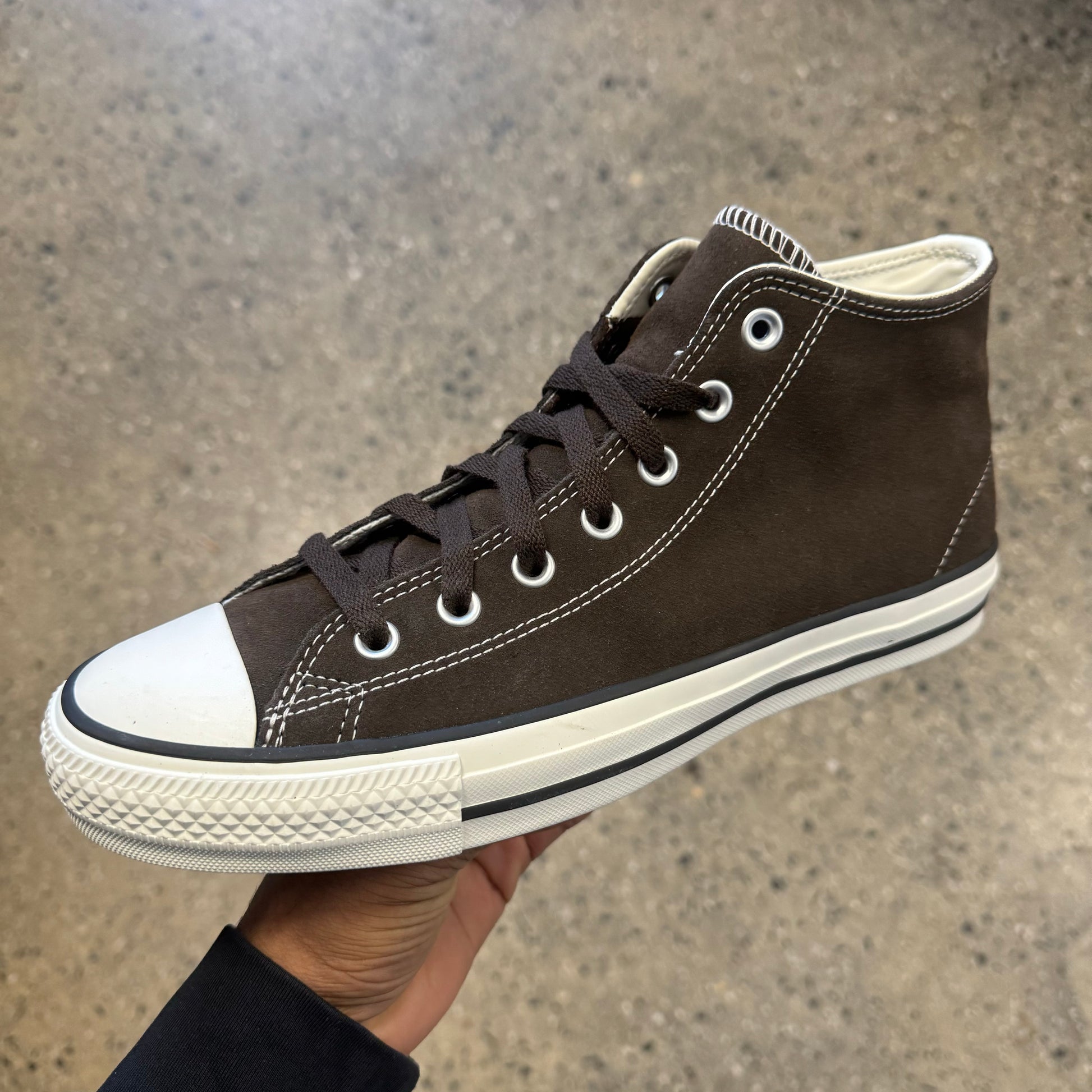 brown sneaker with white sole and toe, side view