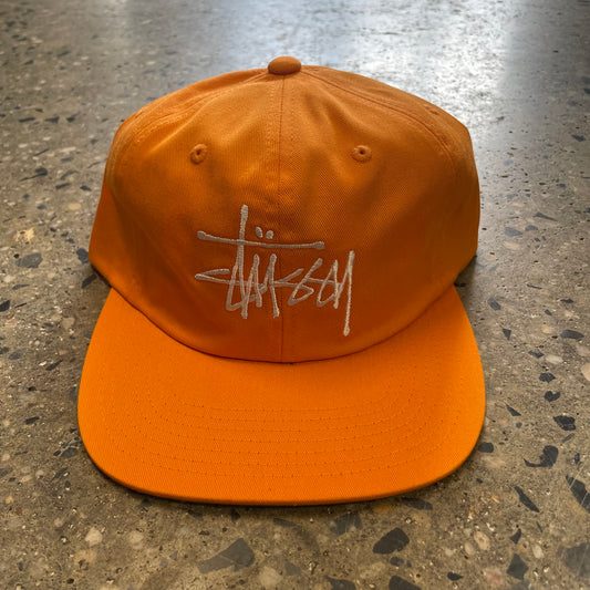 orange stussy logo hat, white stussy hand style logo