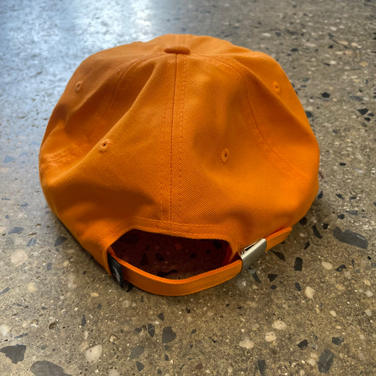rear view of orange stussy cap