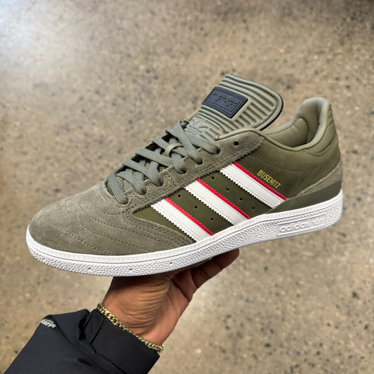 olive suede sneaker with white and red stripes
