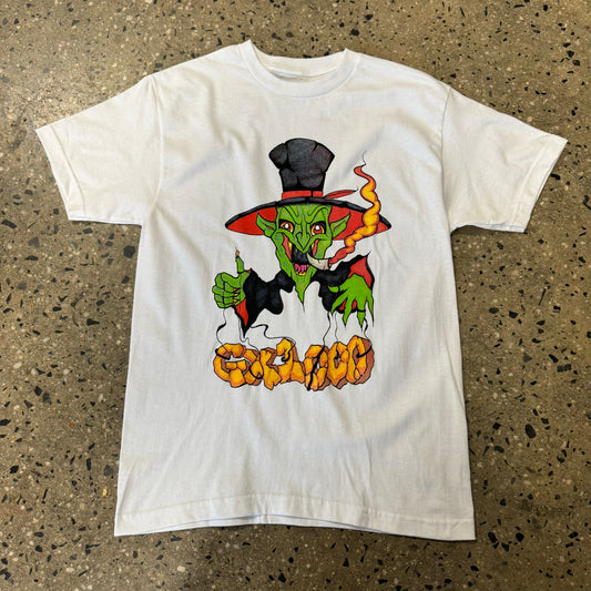 scary green and black clown wearing a hat smoking a joint printed on center chest of a white t-shirt