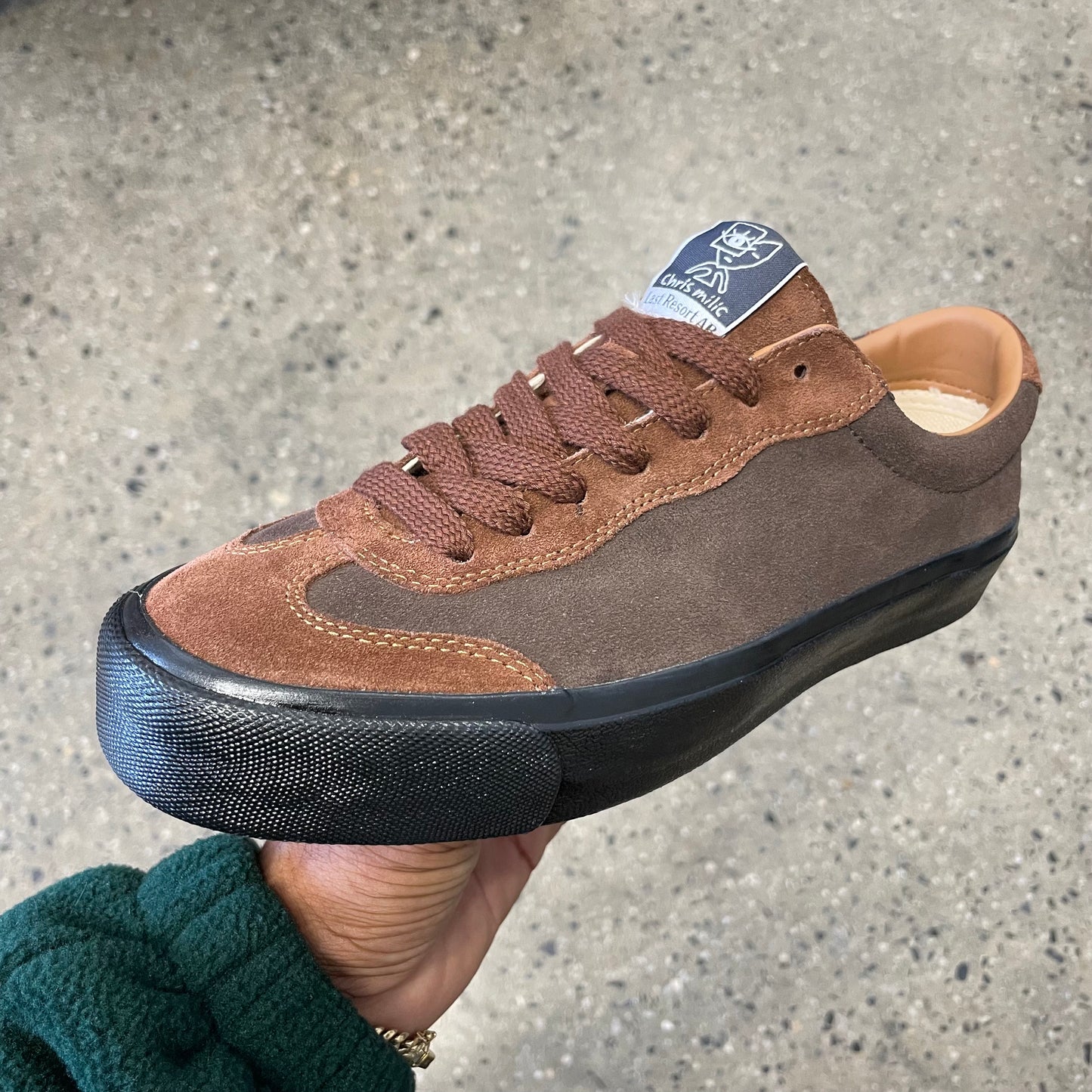 two toned brown suede sneaker with black sole, side view