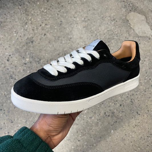 black leather and suede sneaker with white sole, side view