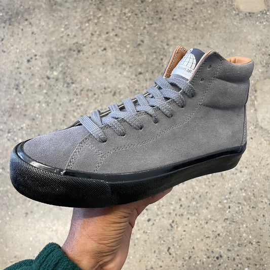 grey suede hi top sneaker with black sole, side view