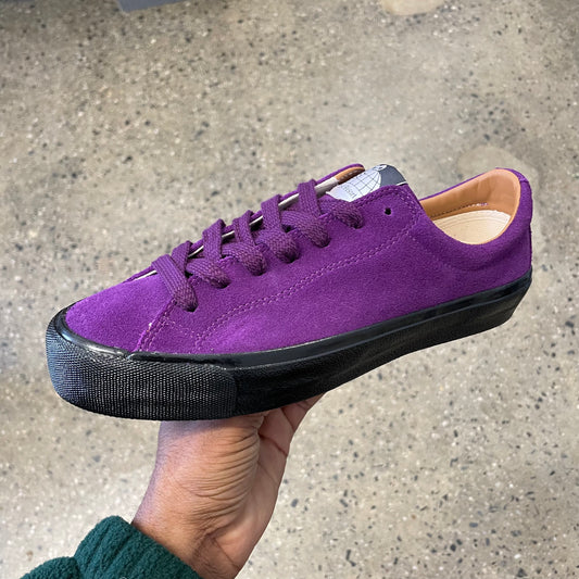 purple suede sneaker with black sole, side view
