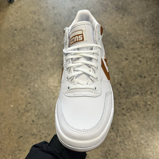 white leather sneaker with brown stripe and star, front view
