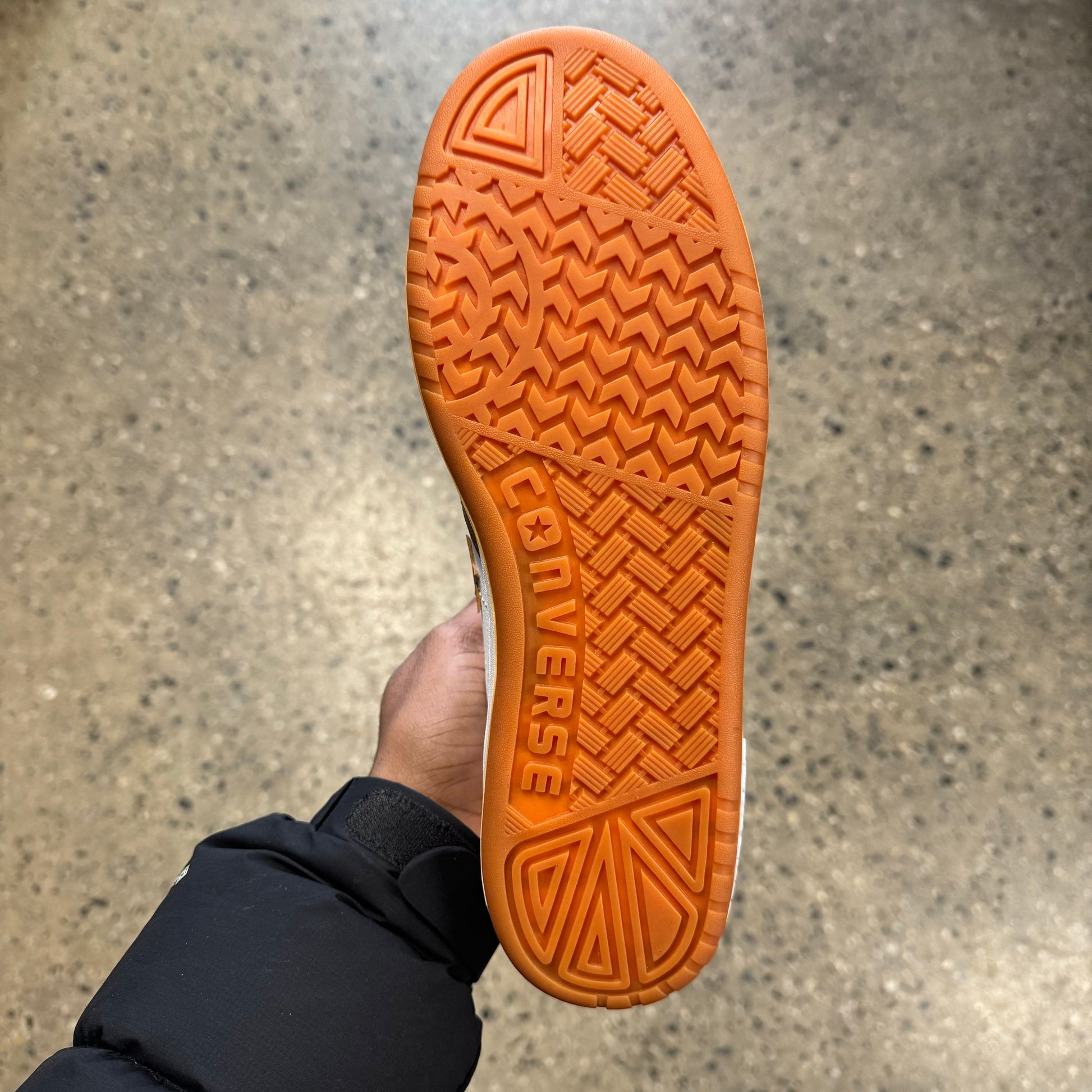 orange sole, bottom of sneaker