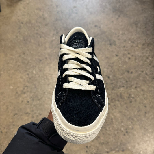 black suede sneaker with white stripes, star, sole, and stitch, front view