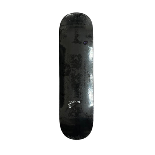 Black skateboard deck with diamond plate pattern on a white surface