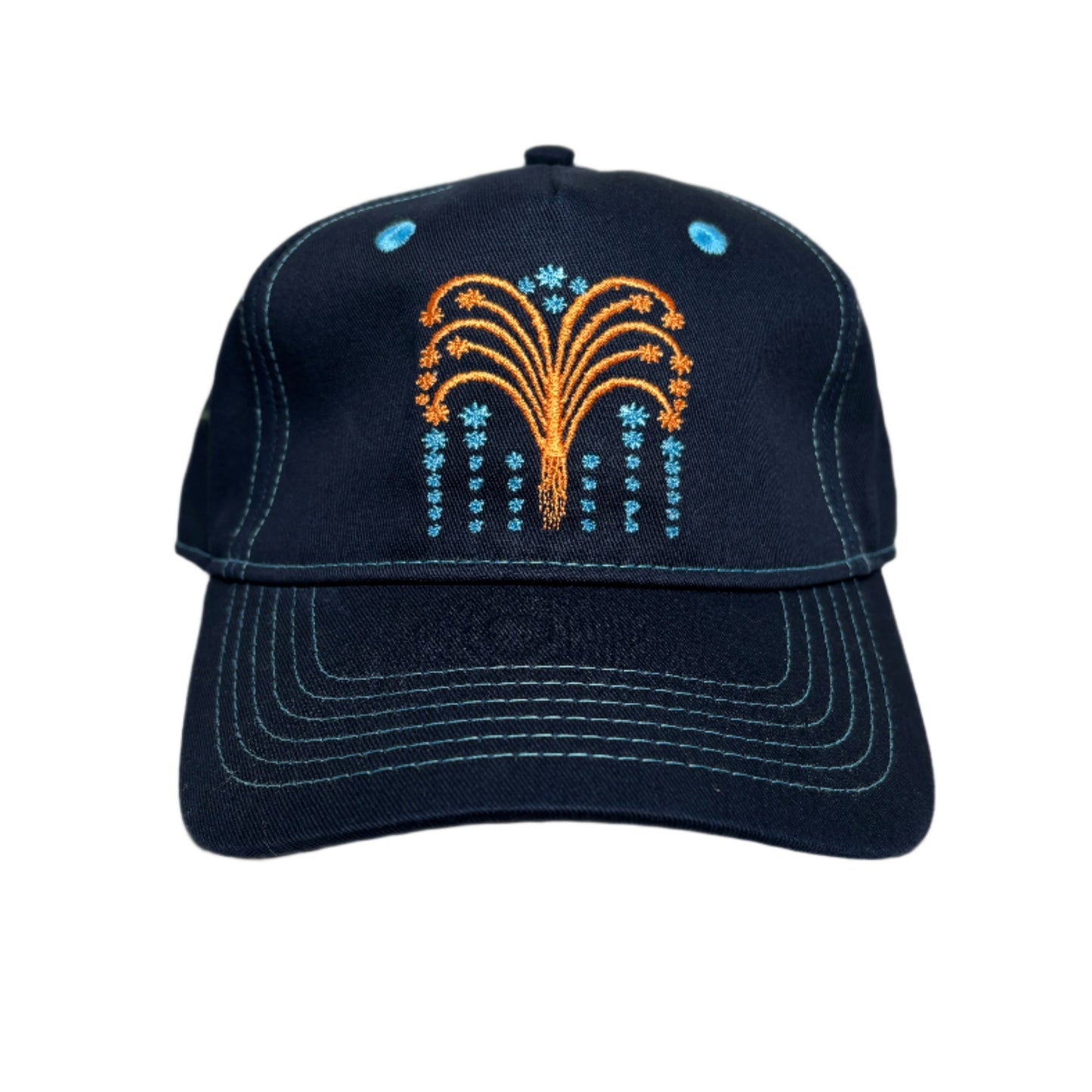Navy blue cap with embroidered design on a white surface