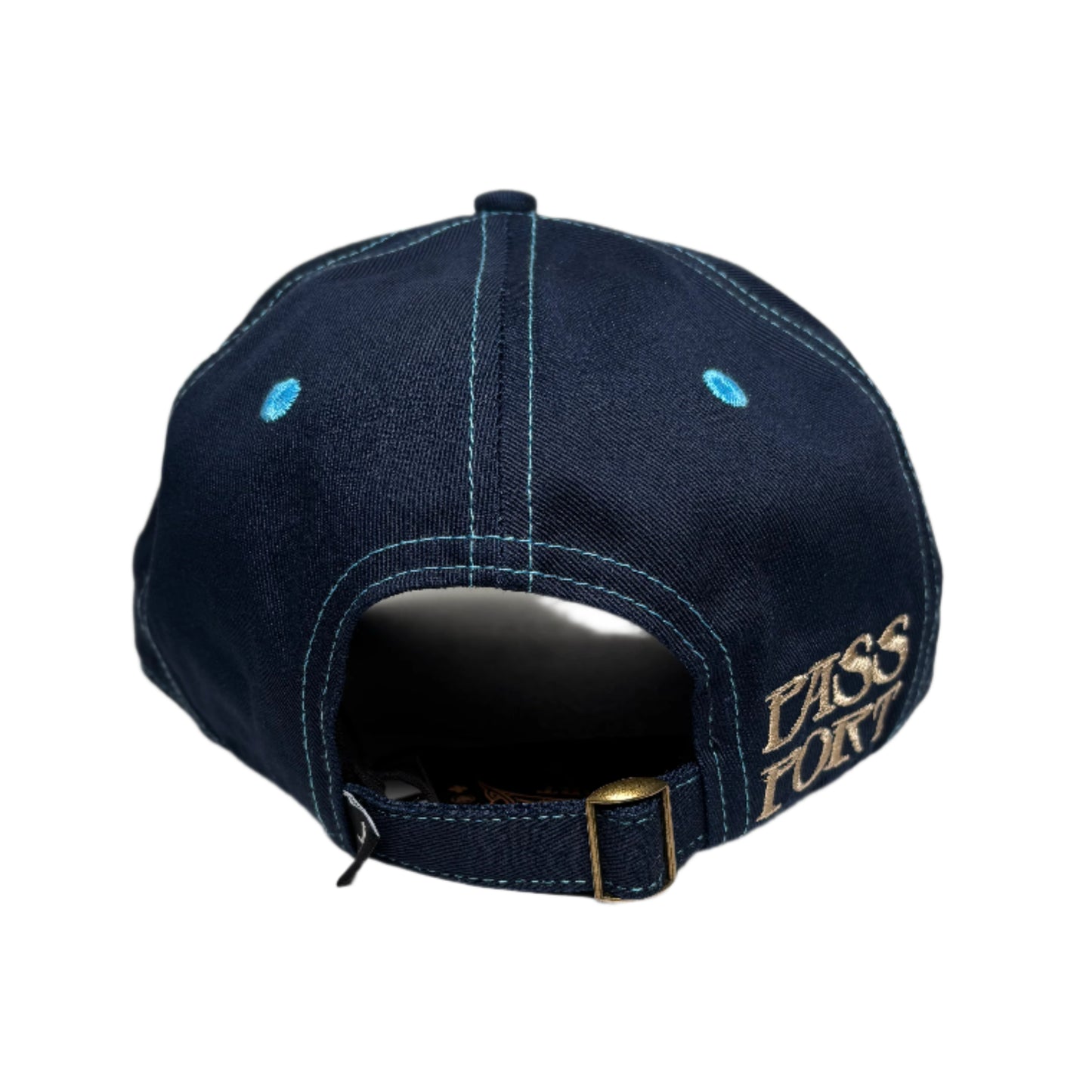 Navy blue cap with gold logo on a white surface