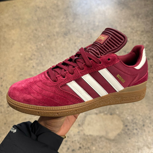 burgundy leather and suede sneaker with white stripes and gum sole