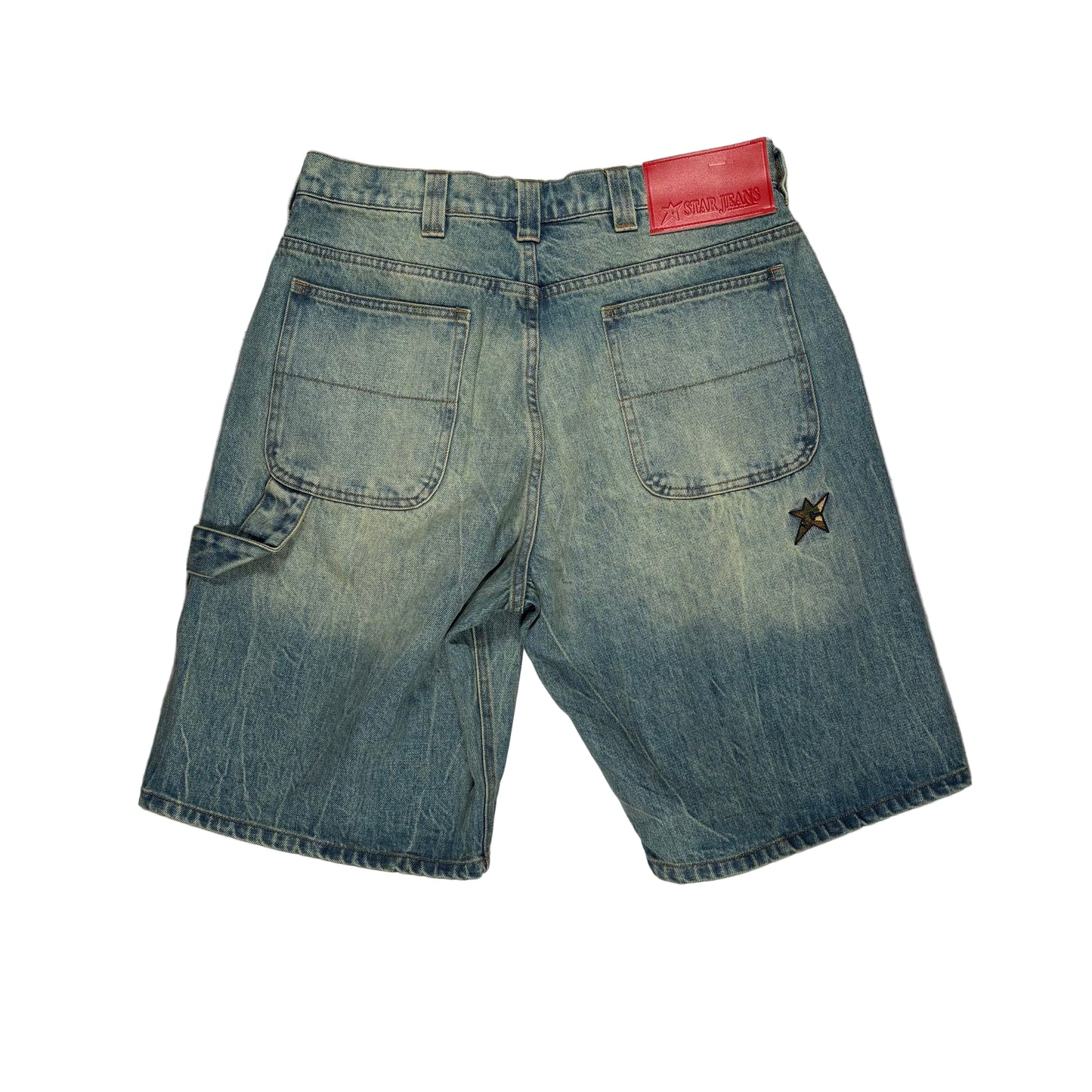 Blue denim shorts with a red patch on a white surface