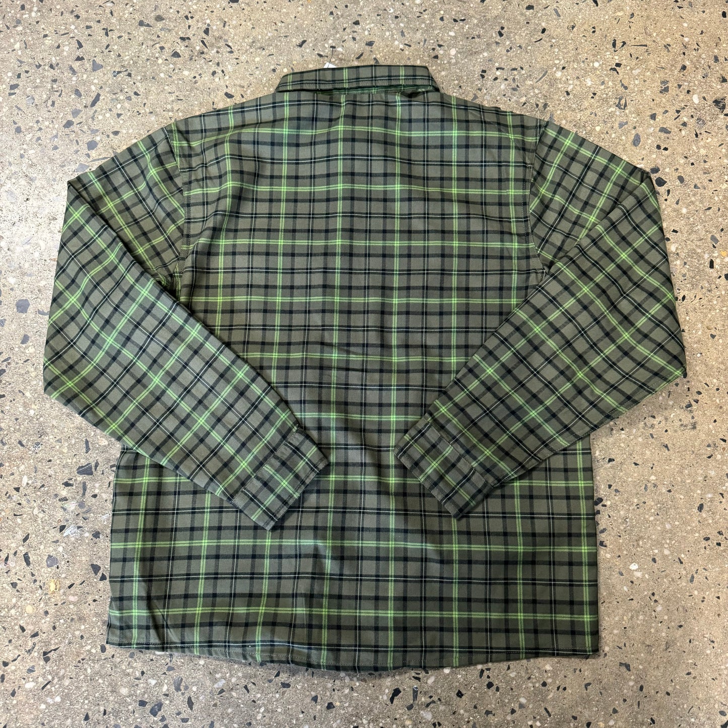 rear view of green and black plaid flannel