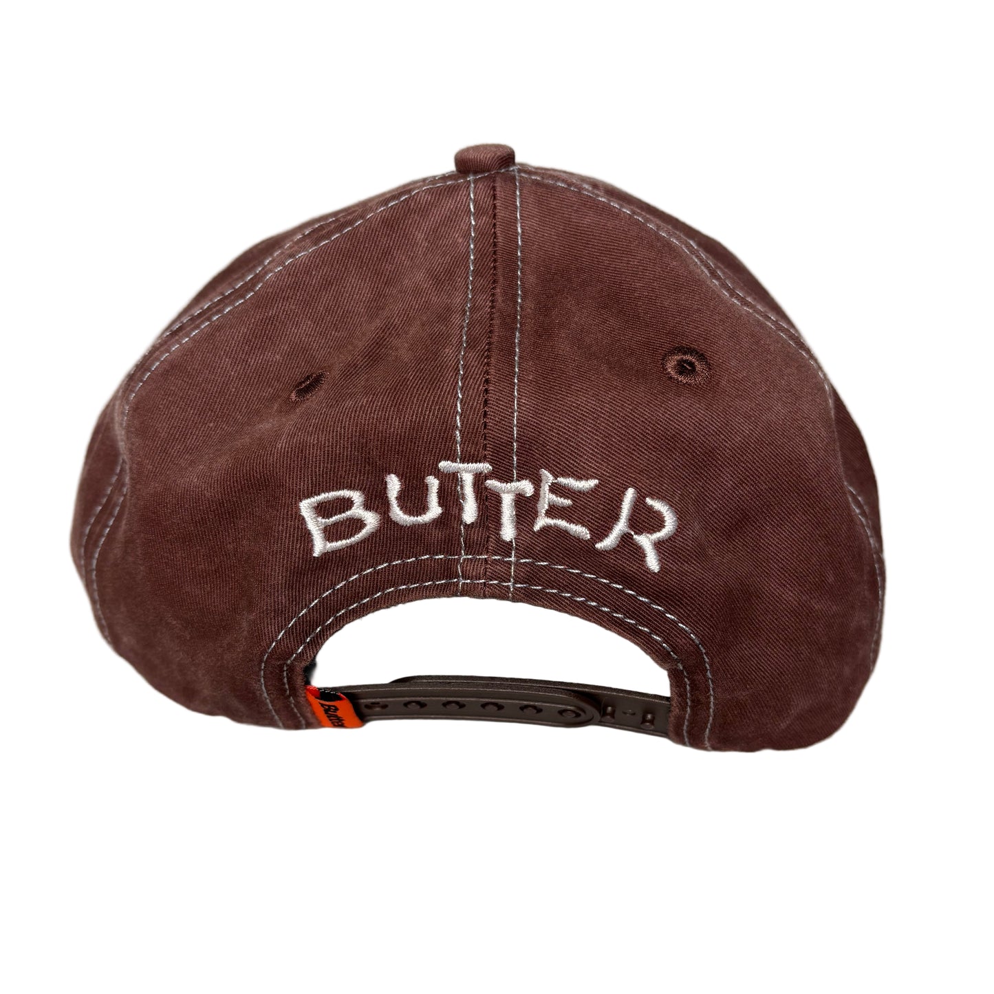 rear view of Brown cap with 'BUTTER' branding on a white background